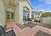 A private terrace at the front of the home offers seating and lounging areas. 