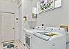 Laundry room with sink, washer and dryer