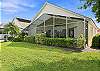 The large, screened in lanai offers a beautiful sunset lake view.