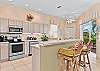 Fully equipped kitchen with breakfast bar and breakfast nook with lake view