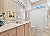 A shower-tub combo in the guestbathroom