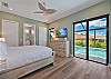 The primary suite features a King bed, smart TV, large walk-in closet and pool access