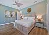 The primary suite features a King bed, smart TV, large walk-in closet and pool access