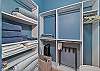 The first Guest Bedroom suite is equipped with a King bed, Smart TV and walk-in closet.