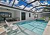 A heated pool with an attached spa and a sun shelf with in-water loungers, perfect for soaking up the Florida sun. A removable pool safety fence gives families with little ones extra peace of mind.