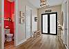 Spacious and welcoming entrance with bench seating