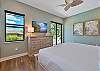 The primary suite features a King bed, smart TV, large walk-in closet and pool access