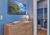 The first Guest Bedroom suite is equipped with a King bed, Smart TV and walk-in closet.