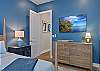 The first Guest Bedroom suite is equipped with a King bed, Smart TV and walk-in closet.