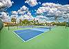 Royal Woods amenities include a sparkling community pool, a lakeside clubhouse, tennis courts, and shuffleboard courts, along with peaceful lake and nature views throughout