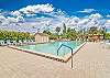 Royal Woods amenities include a sparkling community pool, a lakeside clubhouse, tennis courts, and shuffleboard courts, along with peaceful lake and nature views throughout