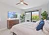 The primary bedroom features a king size bed, smart TV, office nook and sliding doors to the patio!