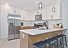 Fully equipped new kitchen with bar seating