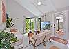 Living with smart TV and sliding doors opening up to the patio