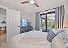 The guest bedroom is equipped with a queen size bed and smart TV