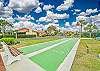 Royal Woods amenities include a sparkling community pool, a lakeside clubhouse, tennis courts, and shuffleboard courts, along with peaceful lake and nature views throughout