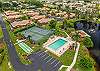 Royal Woods amenities include a sparkling community pool, a lakeside clubhouse, tennis courts, and shuffleboard courts, along with peaceful lake and nature views throughout