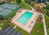 Royal Woods amenities include a sparkling community pool, a lakeside clubhouse, tennis courts, and shuffleboard courts, along with peaceful lake and nature views throughout