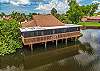 Royal Woods amenities include a sparkling community pool, a lakeside clubhouse, tennis courts, and shuffleboard courts, along with peaceful lake and nature views throughout