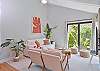 Living with smart TV and sliding doors opening up to the patio