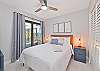 The guest bedroom is equipped with a queen size bed and smart TV