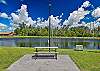 Royal Woods amenities include a sparkling community pool, a lakeside clubhouse, tennis courts, and shuffleboard courts, along with peaceful lake and nature views throughout