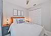 The guest bedroom is equipped with a queen size bed and smart TV