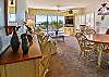 Large living/dining area with comfortable furnishings and a beautiful view