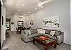 Spacious living room with sectional sofa and dining area
