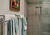 Bathroom detail with fresh towels and glass shower