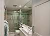 Modern bathroom with glass-enclosed shower