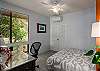 Bedroom with desk and view