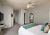 Master bedroom with ensuite bathroom, ceiling fan and split AC