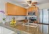 Modern kitchen with granite counters and stainless appliances