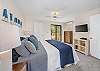 Spacious bedroom retreat featuring a king bed and peaceful views.
