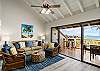Coastal-themed living room with lanai access and ocean view.