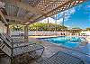 Resort-style pool area with both sun and shade.