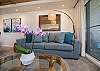 Relax in the bright and inviting living room, accented with island-inspired décor.