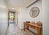 Welcoming entryway with coastal accents and natural wood details.
