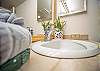 Bathroom vanity with fresh towels and modern faucet.