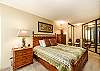 Relax in comfort with a queen bed and plenty of storage.