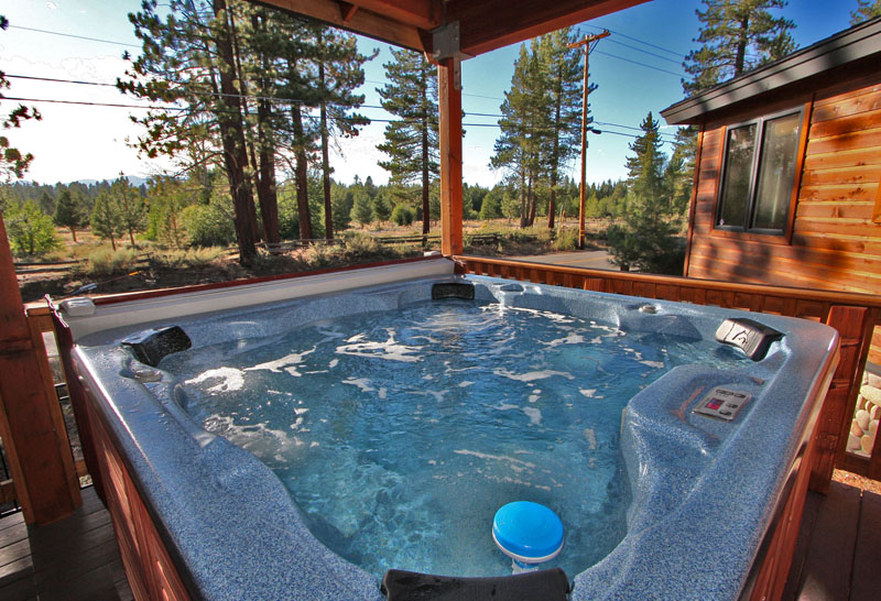 Relax in the large and comfortable hot tub with views of the meadow across the street