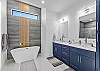 Luxury bath with large shower and luxurious soaking tub.