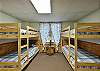 Downstairs bedroom with two sets of bunkbeds.