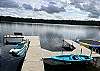 Dock view with 2 kayaks, 3 paddleboards and water trampoline available for use with your rental!