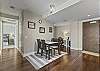Dining area with table that seats four people.