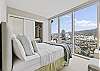 The second bedroom offers a queen-size bed and floor to ceiling windows to bring in the breathtaking views out and over the city and Koolau Mountains!