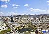 Panoramic views across Waikiki and Honolulu skyline.