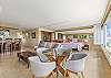 Living room with adjacent four-person dining room table perfect for formal or informal meals and a perfect place for your morning coffee and enjoying the spectacular ocean views!