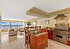 Full-sized appliances compliment the chef's kitchen with ocean views to die for.  Window's both front and back allow for excellent cross breeze through the unit.